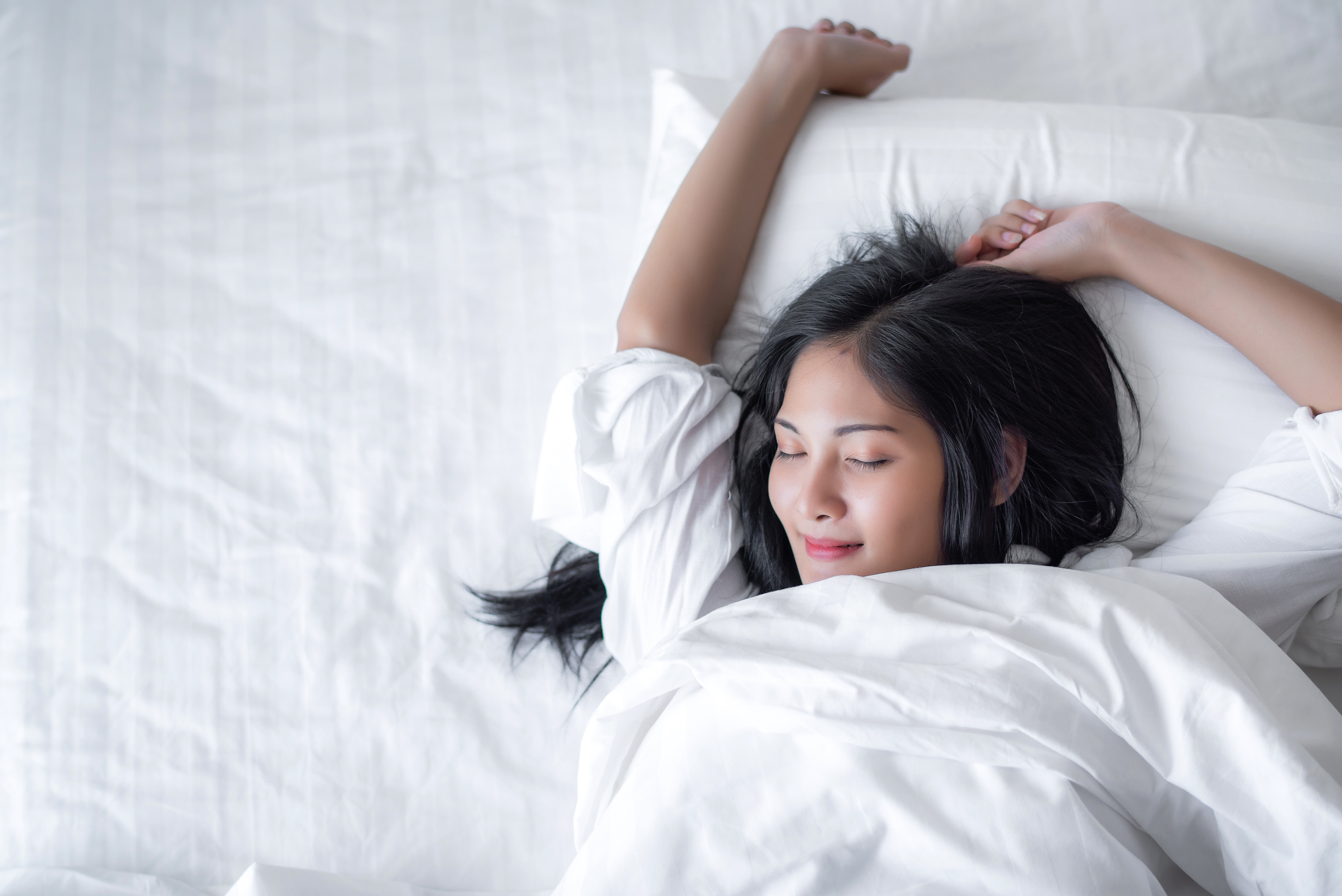 happy woman on mattress